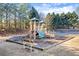 Community playground featuring a playset with slides and swings for Gathering fun at 2069 Brightleaf Way # 123, Marietta, GA 30060