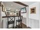 Basement bar area with a wooden countertop, beverage cooler, and decorative wall accents at 320 Spyglass Blf, Alpharetta, GA 30022