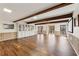 Open concept basement with wood floors, built-in cabinets, and projector screen at 320 Spyglass Blf, Alpharetta, GA 30022