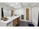 Bathroom with a double sink vanity, modern fixtures, and a tiled shower-tub combination at 320 Spyglass Blf, Alpharetta, GA 30022