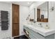 A sleek bathroom features a double sink vanity and heated towel rack for ultimate comfort at 320 Spyglass Blf, Alpharetta, GA 30022