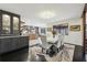 Stylish dining room with a modern light fixture, elegant chairs, and a view into the open kitchen at 320 Spyglass Blf, Alpharetta, GA 30022