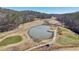 Beautiful aerial shot of the expansive golf course featuring a large water hazard at 320 Spyglass Blf, Alpharetta, GA 30022