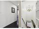 Upstairs hallway featuring wood floors, staircase and contemporary lighting at 320 Spyglass Blf, Alpharetta, GA 30022