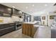 Modern kitchen with stainless steel appliances, a large island, and stylish cabinetry at 320 Spyglass Blf, Alpharetta, GA 30022