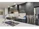 Modern kitchen with stainless steel appliances and fixtures at 320 Spyglass Blf, Alpharetta, GA 30022