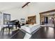 Spacious living area featuring dark wood floors, white furniture, and natural light from a large window at 320 Spyglass Blf, Alpharetta, GA 30022