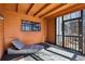 Relaxing screened porch featuring an outdoor lounge chair at 320 Spyglass Blf, Alpharetta, GA 30022