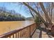 A deck with a railing overlooking the river at 320 Spyglass Blf, Alpharetta, GA 30022