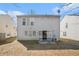 Backyard with a view of the home's exterior and rear patio at 3226 Wellington Sw Walk, Atlanta, GA 30331