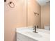 Bathroom featuring a white single sink vanity, bronze fixtures, and a large mirror at 3226 Wellington Sw Walk, Atlanta, GA 30331