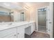 Bathroom featuring double sink vanity, large mirror and tile floors at 3226 Wellington Sw Walk, Atlanta, GA 30331