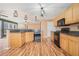 Stylish kitchen showcasing wood cabinetry, black appliances, and sleek countertops at 3226 Wellington Sw Walk, Atlanta, GA 30331