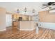 Well-lit kitchen featuring a breakfast bar, wood cabinets, and modern appliances at 3226 Wellington Sw Walk, Atlanta, GA 30331