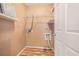 Laundry room with open shelving and laminate wood floors at 3226 Wellington Sw Walk, Atlanta, GA 30331