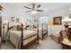 Comfortable bedroom with two twin beds, soft carpeting, and a ceiling fan at 236 Augusta Walk, Canton, GA 30114