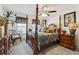 Elegant bedroom featuring a four-poster bed, side tables, and soft lighting at 236 Augusta Walk, Canton, GA 30114