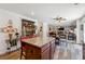 Open concept kitchen featuring wood cabinets, granite countertops, stainless steel appliances, and hardwood floors at 236 Augusta Walk, Canton, GA 30114