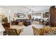 Comfortable living room featuring a leather sofa, vintage decor, and natural light at 236 Augusta Walk, Canton, GA 30114