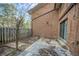 Exterior brick wall and view of the backyard at 2570 Bradford Ne Sq, Atlanta, GA 30345