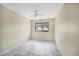 Bedroom featuring neutral walls, tile floor, and a ceiling fan at 2570 Bradford Ne Sq, Atlanta, GA 30345