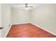 Bedroom features neutral paint, ceiling fan, and wood-look floors at 2570 Bradford Ne Sq, Atlanta, GA 30345