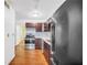 Galley kitchen featuring stainless steel oven and dark wood cabinets at 2570 Bradford Ne Sq, Atlanta, GA 30345