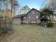 Back exterior view of home with siding and garage at 3121 Bonds Lake Nw Rd, Conyers, GA 30012