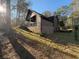 Exterior showing house with rear deck, and wooded backyard at 3121 Bonds Lake Nw Rd, Conyers, GA 30012