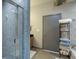 Modern bathroom featuring a glass shower, gray tile, and convenient storage shelves for towels at 5300 Peachtree Rd # 2604, Atlanta, GA 30341