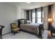 Bedroom featuring a queen-sized bed, neutral decor, and ample natural light at 5300 Peachtree Rd # 2604, Atlanta, GA 30341