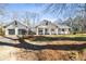 Charming home with inviting front porch, attached garage and basketball hoop at 915 Homer Rd, Woodstock, GA 30188