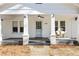 Welcoming front porch with bench seating and view of the house number at 915 Homer Rd, Woodstock, GA 30188