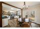 Charming kitchen featuring stainless steel appliances, black countertops, and a wooden dining table at 915 Homer Rd, Woodstock, GA 30188