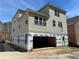 New construction home with gray siding, a two car garage, and modern windows at 2585 Governors Walk Blvd, Snellville, GA 30078
