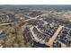 Aerial view displays a thoughtfully designed community of townhomes located near shopping centers and a developing neighborhood at 334 Cherokee Station Cir, Woodstock, GA 30188