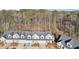 Aerial view of a new home community with trees surrounding the area at 334 Cherokee Station Cir, Woodstock, GA 30188