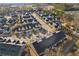 Aerial view of townhouses with driveways, tree-lined streets and landscaping, a serene residential community at 334 Cherokee Station Cir, Woodstock, GA 30188