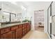 Beautiful bathroom with double sinks, granite counters, and separate shower at 334 Cherokee Station Cir, Woodstock, GA 30188