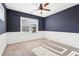 Bedroom with a ceiling fan and a window for natural light at 334 Cherokee Station Cir, Woodstock, GA 30188