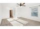 Bright bedroom with neutral carpet and natural light from a large window at 334 Cherokee Station Cir, Woodstock, GA 30188