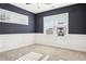 Bedroom featuring wainscotting, dark paint, and natural light at 334 Cherokee Station Cir, Woodstock, GA 30188