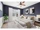 Bedroom with a ceiling fan and a window for natural light at 334 Cherokee Station Cir, Woodstock, GA 30188