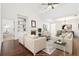 Bright and open living room featuring a fireplace, built-in shelving, and hardwood floors at 334 Cherokee Station Cir, Woodstock, GA 30188