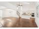 Open-concept living room with kitchen, hardwood floors and vaulted ceilings with skylights at 334 Cherokee Station Cir, Woodstock, GA 30188