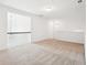 Open loft space with neutral carpet, railing and plenty of natural light at 334 Cherokee Station Cir, Woodstock, GA 30188