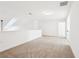 Neutral carpeted loft space with white walls and modern lighting at 334 Cherokee Station Cir, Woodstock, GA 30188