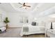 Bright main bedroom featuring a trey ceiling, ceiling fan, and windows for natural light at 334 Cherokee Station Cir, Woodstock, GA 30188