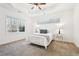 Bright main bedroom featuring a trey ceiling, ceiling fan, and windows for natural light at 334 Cherokee Station Cir, Woodstock, GA 30188