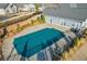 Aerial view of the community pool, covered, with surrounding landscaping and community buildings at 334 Cherokee Station Cir, Woodstock, GA 30188